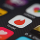 The ‘Tinder’ app logo is seen amongst other dating apps on a mobile phone screen on November 24, 2016 in London, England.